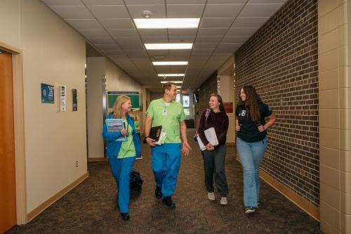 Students walk down a hallway in Moorhead
